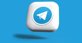 a blue and white square button with a paper airplane on it