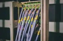 blue LAN cable plugged in green and black router