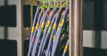 blue LAN cable plugged in green and black router